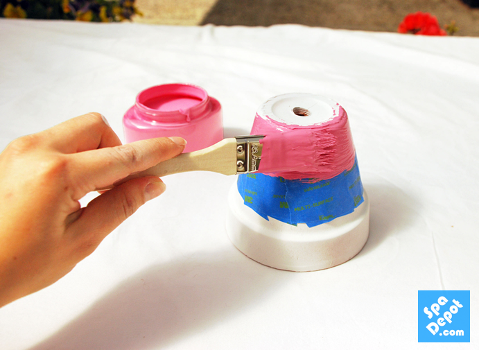 Tape your pots with painters tape to create fun designs