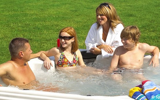 Family enjoying hot tub