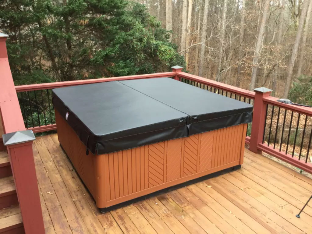 Beautiful hot tub sitting on elevated wood deck